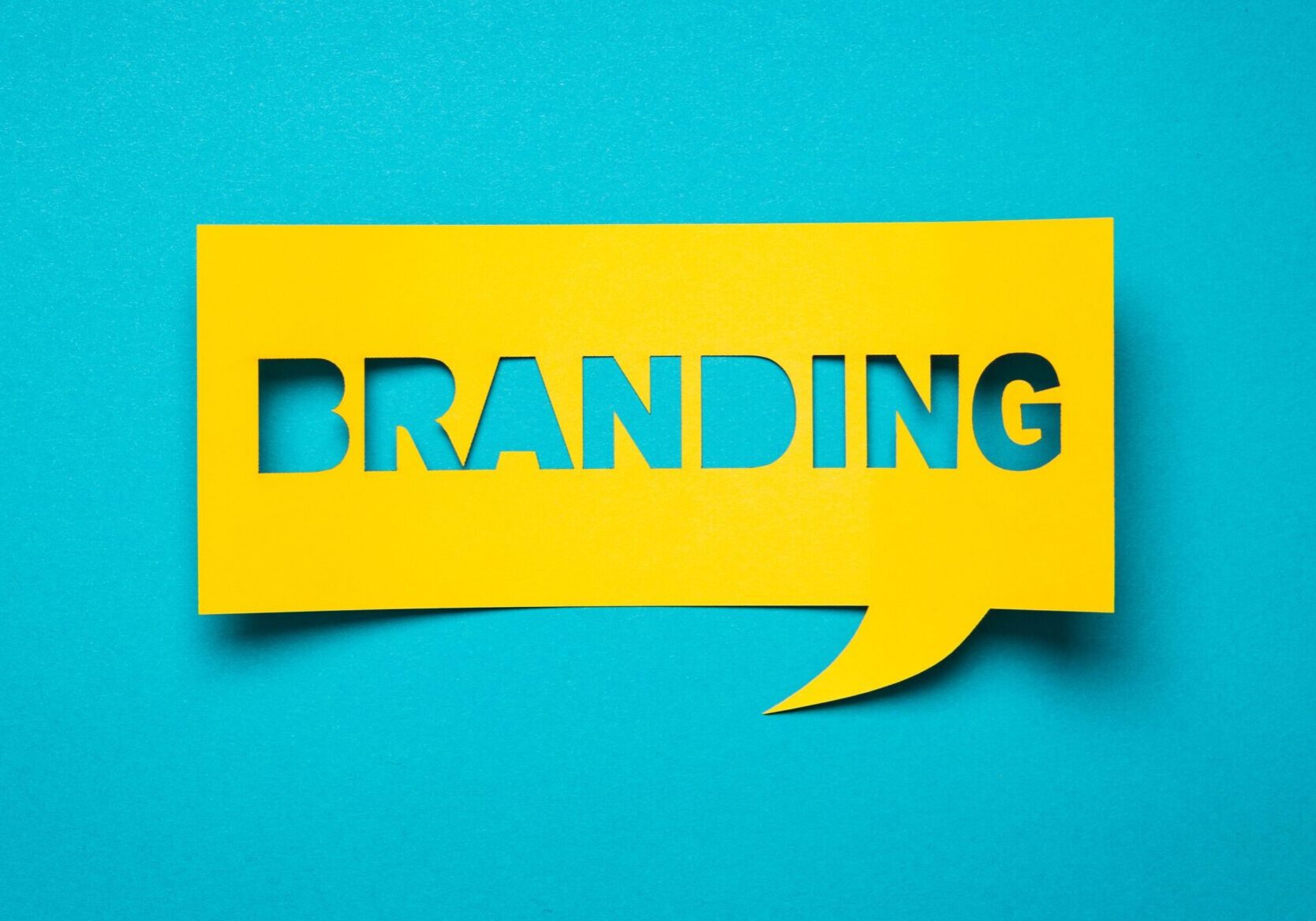 Bubble speech with cut out phrase "branding" in the paper.